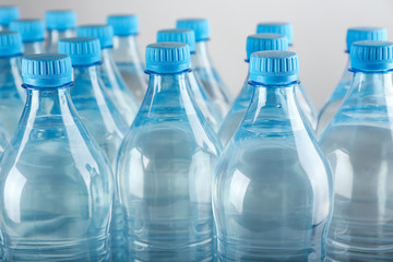 Bottles of water on light background