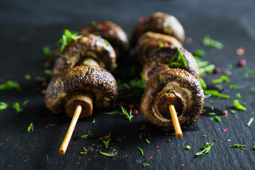 Grilled champignons on skewer