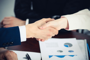 Business people shaking hands finishing up a meeting. Handshake at successful negotiation