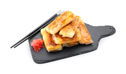 Tasty fried spring rolls on white background