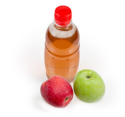 Bottle of the traditional apple cider and two fresh apples