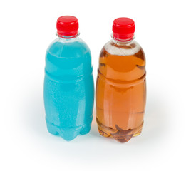 Bottles of traditional and blue exotic cider on white background