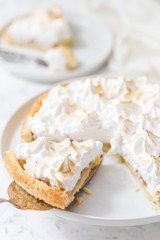 Lemon meringue tart on a white plate
