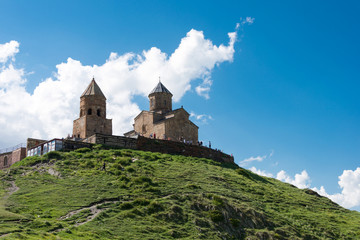 Kazbegi, Georgia - Jun 28 2018: Gergeti Trinity Church on Kazbegi National Park in Kazbegi, Mtskheta-Mtianeti, Georgia.