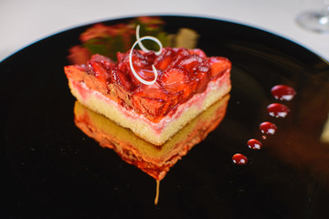 Spring cake with strawberry jam and fresh strawberries