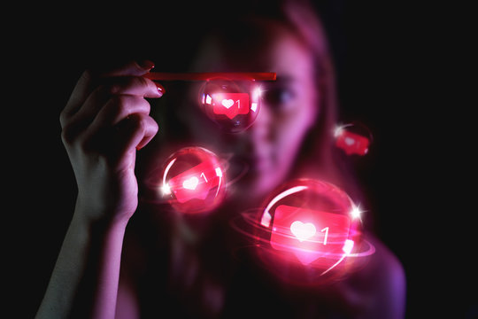 Charming woman with signs in form of like from social network in soap bubbles - Neon pink light