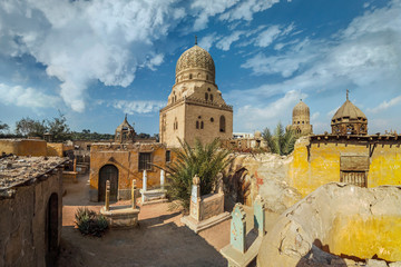 View of the ancient minarets of the tombs of the city of the dead on a sunny day in Cairo