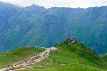 Kazbegi, Georgia - Jun 29 2018: Gergeti Trinity Church on Kazbegi National Park in Kazbegi, Mtskheta-Mtianeti, Georgia.