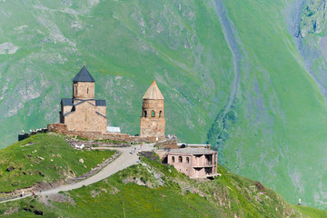 Fototapeta na wymiar Kazbegi, Georgia - Jun 29 2018: Gergeti Trinity Church on Kazbegi National Park in Kazbegi, Mtskheta-Mtianeti, Georgia.