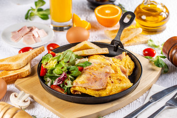 Omelet with ham and salad