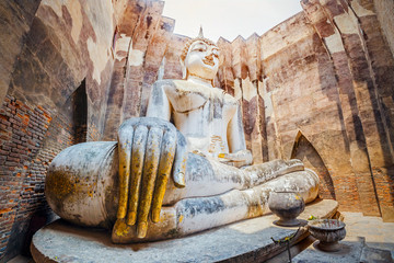 Ancient big buddha statue inside Wat Si Chum temple in Sukhothai, Thailand.