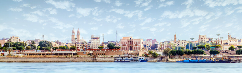 Aswan, Egypt, view of the panorama of the city from the mountain of the west coast of the Nile on a sunny day