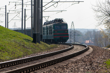 Fototapeta na wymiar Locomotive with freight cars on the turn.