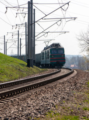 Fototapeta premium Locomotive with freight cars on the turn.