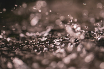 Selective focus drop of water abstract background.Dark tone wallpaper background.