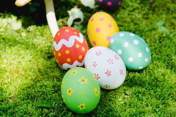 Beautiful Easter multi color egg on garden green grass
