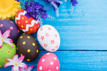 Easter eggs top view on blue wooden background