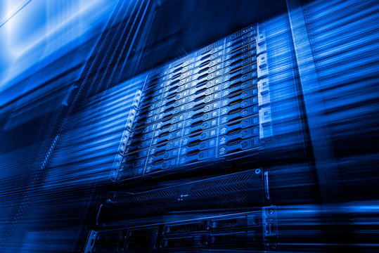 Point of bottom view of array disk storage in data center with depth of field in cool blue tone