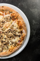 Freshly baked pizza on plate