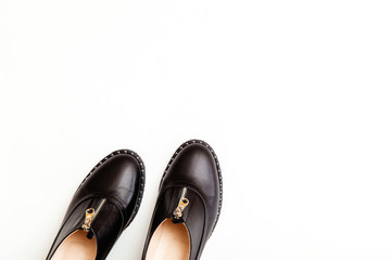 Stylish female spring or autumn shoes in black color. Beauty and fashion concept. Flat lay, top view 