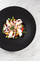 Fresh salad.Concept for a tasty and healthy meal. White stone background.