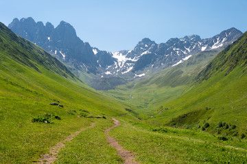 Fototapeta na wymiar Kazbegi, Georgia - Jul 03 2018: Juta valley near Caucasus mountain. a famous landscape in Kazbegi, Mtskheta-Mtianeti, Georgia.