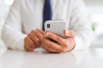 Close up of business man hands using smarpthone