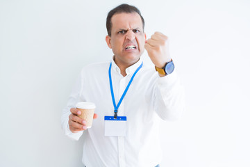 Middle age business man wearing ID card and drinking coffeeover white background annoyed and frustrated shouting with anger, crazy and yelling with raised hand, anger concept