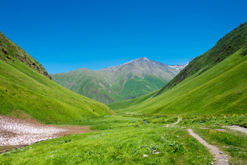 Fototapeta premium Kazbegi, Georgia - Jul 03 2018: Mountain hut at Juta valley near Caucasus mountain. a famous landscape in Kazbegi, Mtskheta-Mtianeti, Georgia.