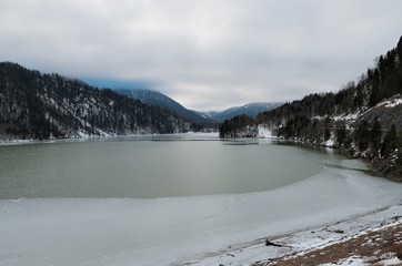 Aerial view on the lake Sylvenstein and bridge in the Alps of Bavaria in winter. Germany, january...