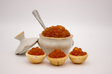 Fototapeta na wymiar Luxury Red Caviar in the bowl. Food photo concept.