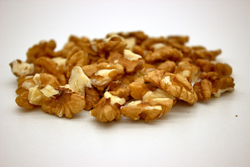 Walnut Kernels (Other Names: Juglans Regia, Persian Walnut, English Walnut, Circassian Walnut). Isolated Image On A White Background