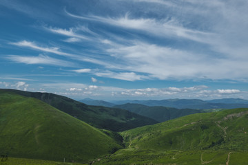 Amazing mountain landscape with sky and a haystack