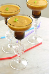 Peach slush with mint in tall glasses, vertical