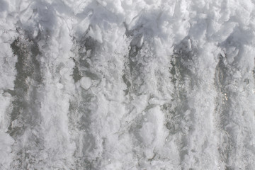 the texture of large flakes of snow in the road print