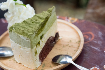 Sweet matcha green tea cake and wipping cream
