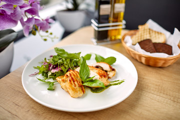 grilled chicken breast and salad