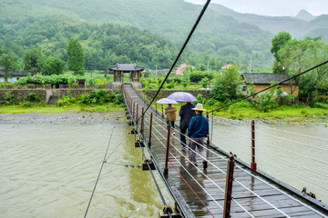 Ancient Chinese Suspension Bridge Architecture in Rainy Days