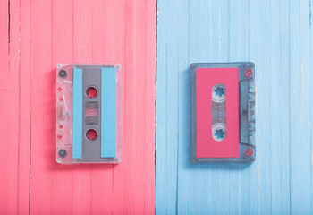 Fototapeta na wymiar Old plastic cassette on wooden background. Retro music concept