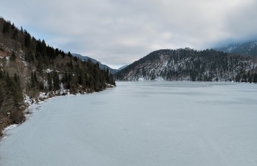 Fototapeta na wymiar Aerial view on the lake Sylvenstein and bridge in the Alps of Bavaria in winter. Germany, january 2018