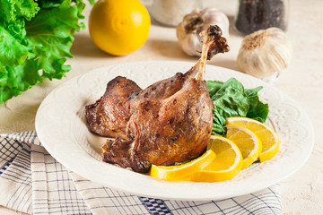 Duck legs confit with orange and salad