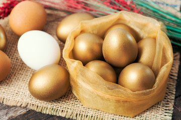 happy easter wishes card -  soft shades of golden color Easter eggs in the nest.