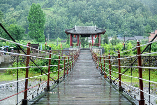Fototapeta Ancient Chinese Suspension Bridge Architecture in Rainy Days