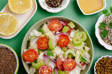 Fototapeta na wymiar Salad of raw vegetables
