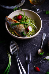 risotto with wild garlic and sea bass.style rustic.