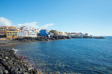 Fototapeta premium Views towards Los Abrigos, a picturesque fishing village in Granadilla de Abona, known for its fine seafood and fish restaurants, a small plaza and a volcanic beach, Tenerife, Canary Islands, Spain