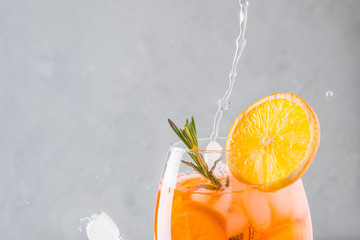 Classic Italian aperol spritz cocktail on light.