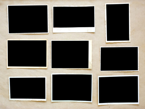 old empty photo frames, grungy photo prints on grungy background with free space for pictures
