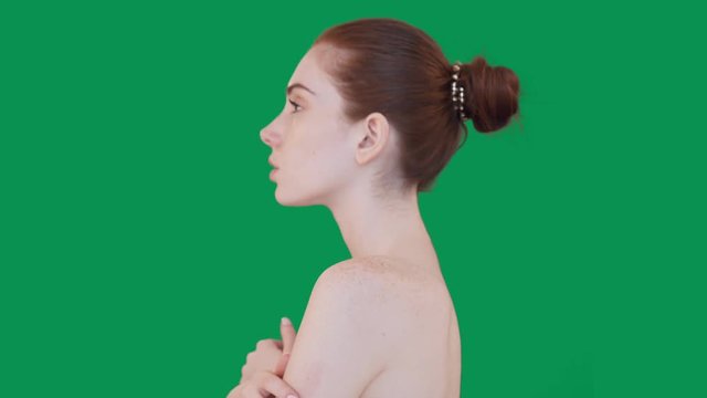 Young redhead woman posing on camera with differents emotions.