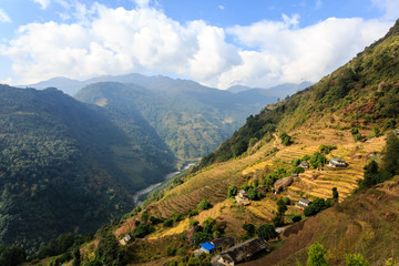 Fototapeta na wymiar Small asian mountain village and terrace fields in autumn in Nepal, Himalaya, Annapurna Conservation Area